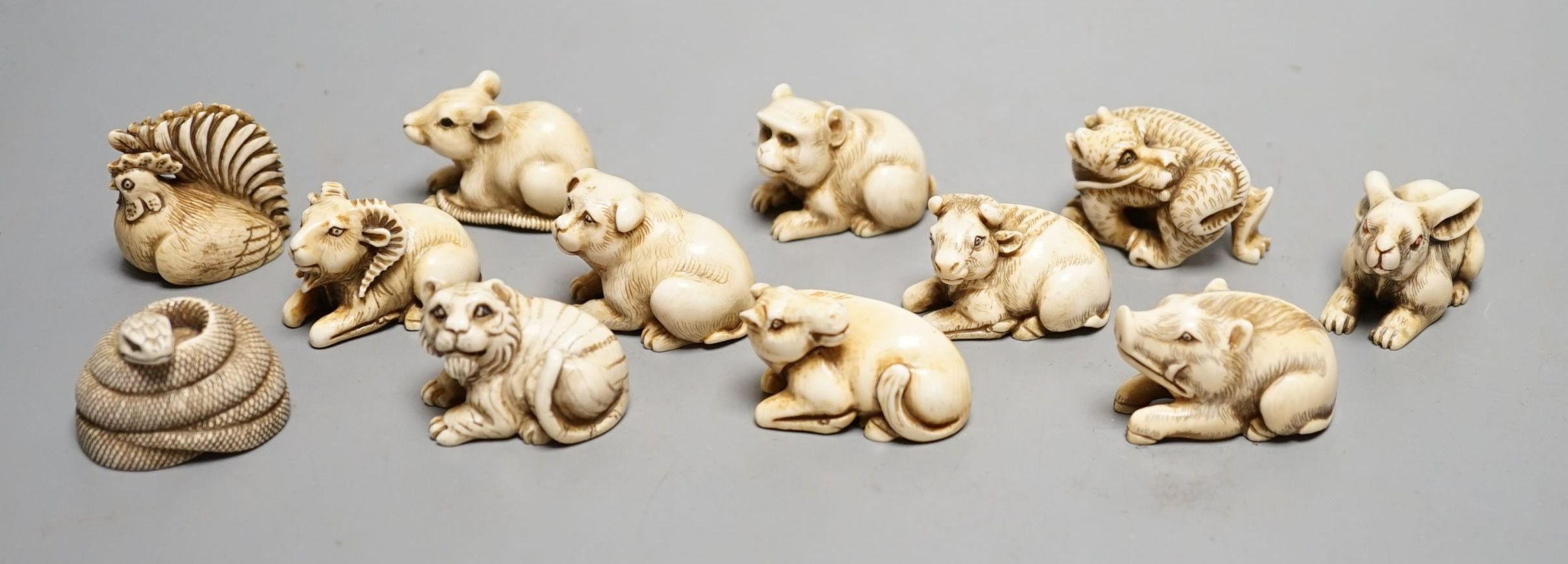 A set of 12 Japanese ivory zodiac animal netsuke, Taisho/early Showa period, signed